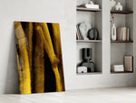 Yellow Story artwork anchoring a wall with bold minimalist palette