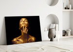 Gold Woman glass wall art styled in a bedroom