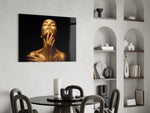 Gold Woman glass print enhancing a study with cinematic drama