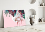 Flamingo glass wall art styled above a bed in a bedroom