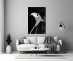 Flower glass wall art styled above a credenza in a bedroom