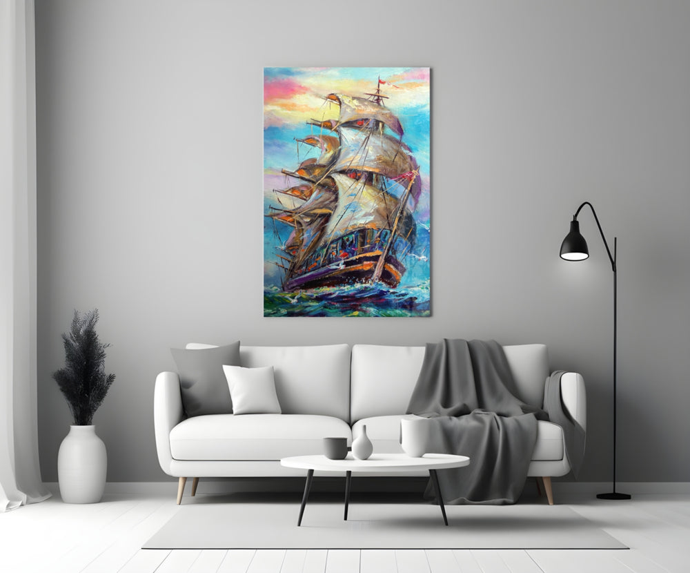 Sailboat glass wall art styled above a console in a living room