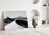 Black Landscape glass wall art styled above a sofa in a living room