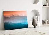 Abstraction glass wall art styled above a credenza in a living room