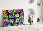 Butterfly glass wall art styled above a sofa in a kids room