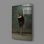 Ballerina close-up showing black-tutu dancer arched in teal smoke