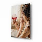 Wine and Women glass wall art displayed above a marble-topped sideboard in a candlelit dining room with burgundy velvet chairs and brass candelabra