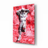 Astronaut and Space Grass glass wall art displayed above a gaming desk in a neon-lit gaming room with RGB chair and matte-black shelves