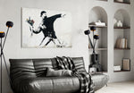 Transverse War glass wall art styled above a sofa in a living room