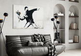 Transverse War glass wall art styled above a sofa in a living room