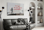If you failed glass wall art styled above a sofa in a living room