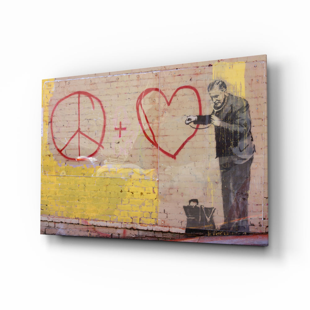 Graffiti Doctor glass wall art displayed above a tan leather sofa in a goldenrod-painted lounge with reclaimed-wood coffee table and brass picture light
