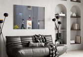 Waiting for Explosion glass wall art styled above a desk in an office