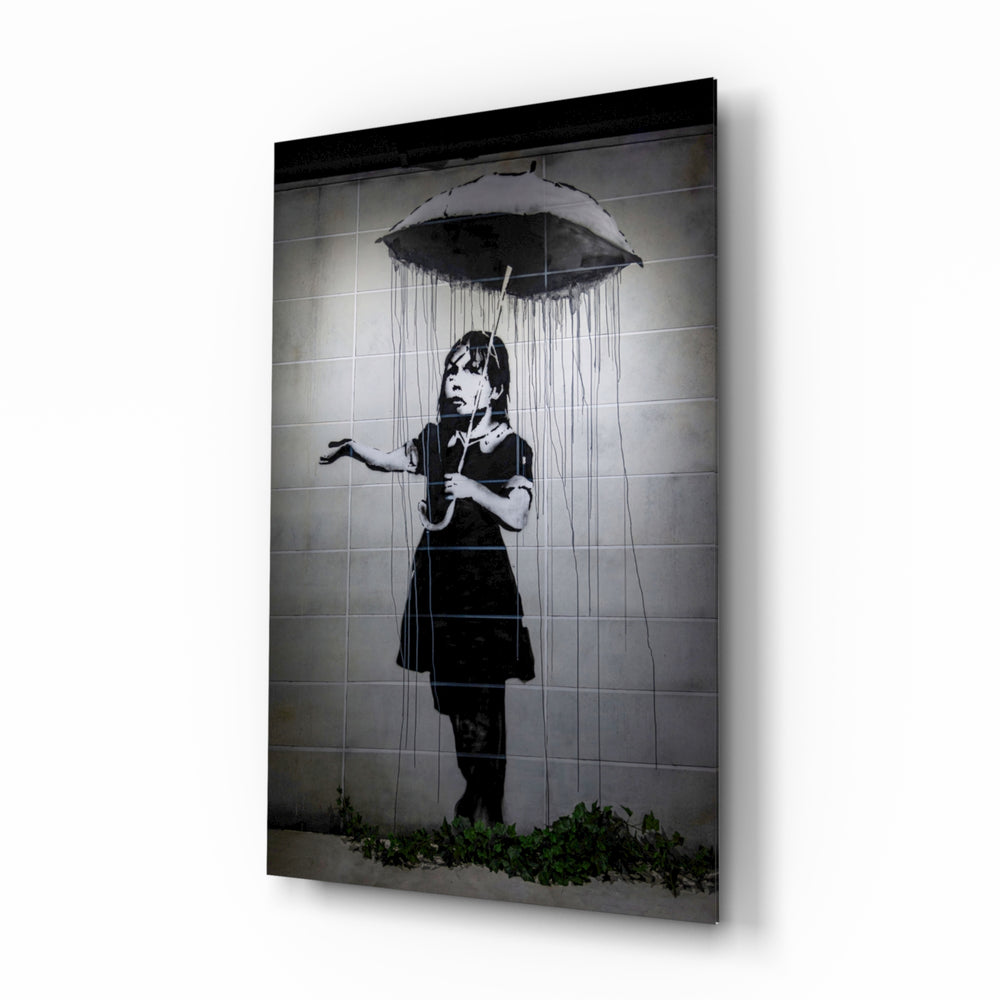 Escape from the Rain glass wall art displayed beside a charcoal linen armchair in a soft-gray hallway with herringbone floor and brass picture light