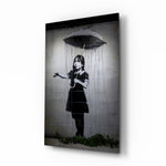 Escape from the Rain glass wall art displayed beside a charcoal linen armchair in a soft-gray hallway with herringbone floor and brass picture light