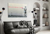 What We Do in Life glass wall art styled above a console in a hallway