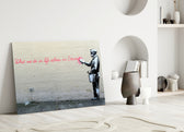 What We Do in Life close-up showing painter spraying pink Eternity quote on cream brick