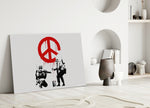 War for Peace close-up showing two stenciled soldiers spraying dripping red peace sign