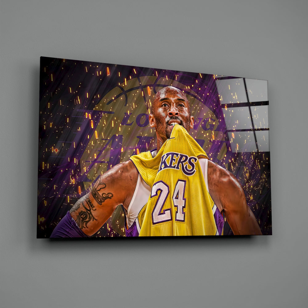 Kobe Bryant close-up showing yellow Lakers 24 jersey amid purple and gold confetti