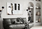Neanderthal glass wall art styled above a sofa in a living room