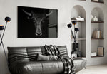 Buffalo glass wall art styled above a leather chair in a man cave