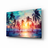 Sunset and Palms glass wall art displayed above a linen bed in a soft-blush bedroom with rattan nightstands and brushed-brass sconces