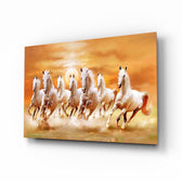 Running Horses glass wall art displayed above a walnut sideboard in a sunlit dining room with cane chairs and brass pendant lamp