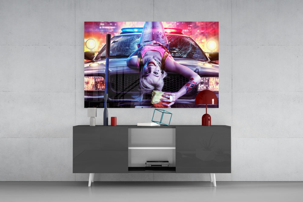 Harley Quinn panel catching screen glow to reveal its electric saturation