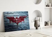Batman close-up showing crimson bat logo dripping across white-painted brick