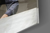 Interrogation artwork anchoring a wall with bold cinematic palette