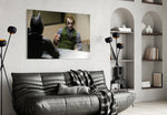 Interrogation glass wall art styled above a sofa in a gaming room