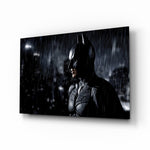 Batman glass wall art displayed above a charcoal sofa in a brick-walled home theater with reclaimed-wood console and projector screen