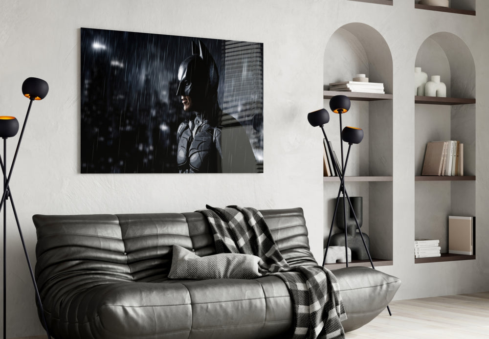 Batman glass wall art styled above a sofa in a gaming room