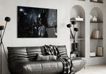 Batman glass wall art styled above a sofa in a gaming room