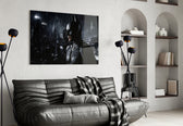 Batman glass wall art styled above a sofa in a gaming room