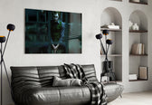 Joker Jail glass wall art styled above a sofa in a gaming room