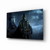 Batman glass wall art displayed above a black gaming sofa in a brick-walled lounge with neon arcade sign and matte-black coffee table