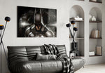 Batman glass wall art styled above a sofa in a gaming room