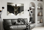 Batman glass wall art styled above a sofa in a gaming room