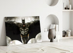 Batman close-up showing armored Dark Knight wings wide before cream bat-symbol