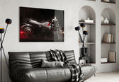 Batmobile glass wall art styled above a desk in a kids room