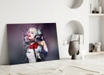 Harley Quinn close-up showing pigtailed heroine glancing back with bat across shoulders