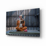 Harley Quinn glass wall art displayed above a leather chesterfield in a brick-walled home theater with reclaimed-wood console and projector screen