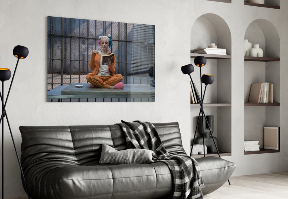 Harley Quinn glass wall art styled above a sofa in a gaming room