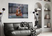 Harley Quinn glass wall art styled above a sofa in a gaming room