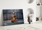 Harley Quinn close-up showing pigtailed heroine reading on prison mattress in cage