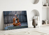 Harley Quinn close-up showing pigtailed heroine reading on prison mattress in cage