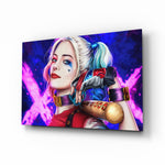 Harley Quinn glass wall art displayed above a black gaming sofa in a brick-walled lounge with neon arcade sign and matte-black coffee table