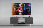 Harley Quinn panel catching screen glow to reveal its electric saturation