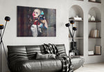 Harley Quinn glass wall art styled above a desk in an office